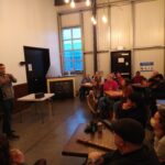 Presenter speaking to the crowd at Pivot Brewing